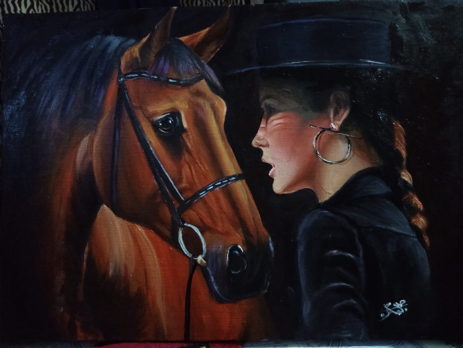 A lady looking towards a Beautiful Horse